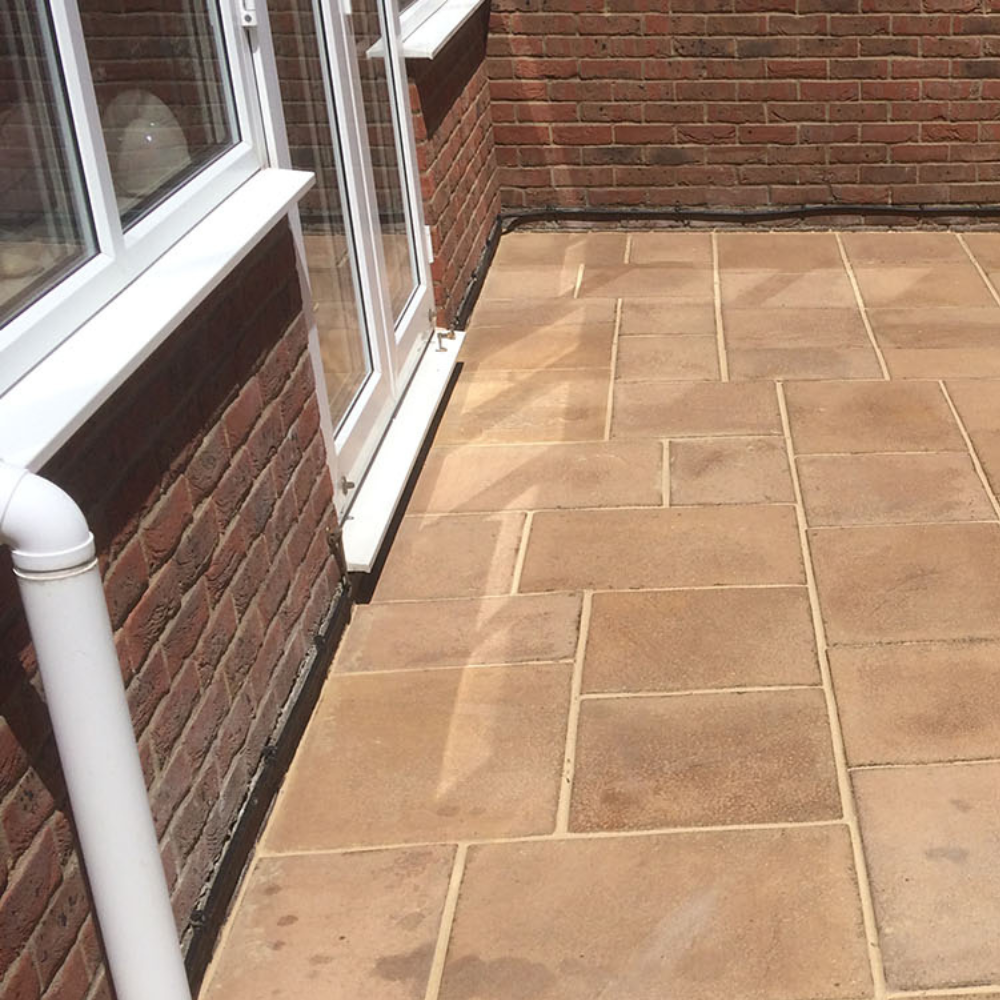 Clean patio after moss removal